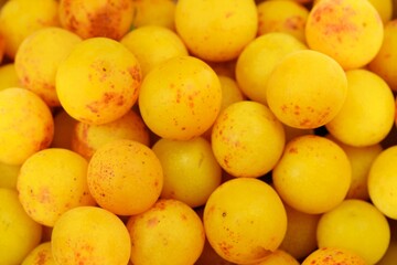 Yellow mirabelle plum fruits closeup, mirabelle fruits background.