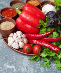 Pepper,paprika, basilik.Georgian food. Georgian spices on a plate.	