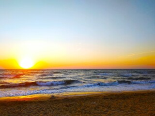 Colorful sunset on seashore.