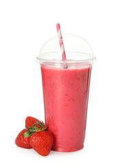 Delicious smoothie with straw in plastic cup and fresh strawberries on white background