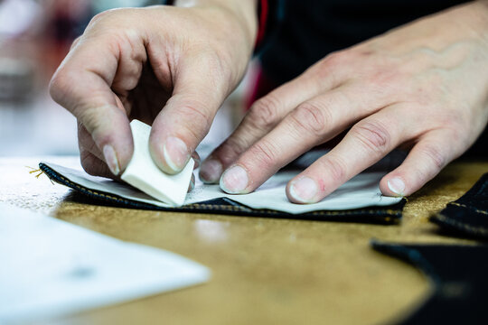 Italian Seamstress Working With Meterstick, Paper Pattern, Denim Fabric, Chalk