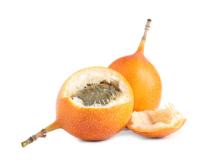 Whole and cut delicious granadillas on white background