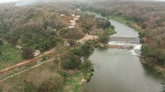 Traveling down over a river, dam on a river in Angola, Africa