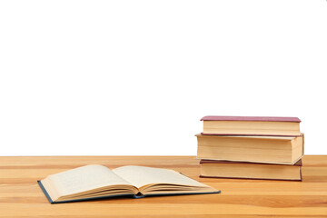 Many books on wooden table against white background. Library material