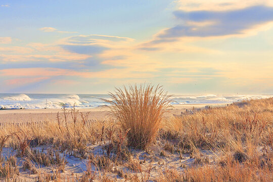 Scenic Afternoon View Of The Ocean City, New Jersey Seashore With Dunes, Beach And Surf.