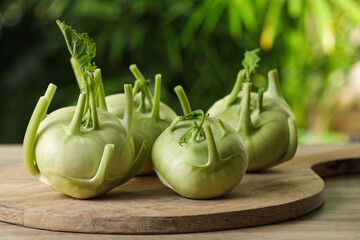Whole ripe kohlrabi plants on wooden table