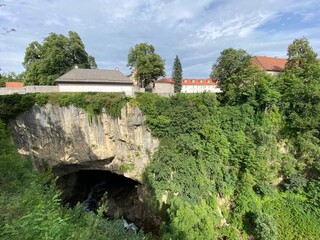Fototapeta na wymiar Jula's abyss at the end of the Gornja Dobra river canyon - Ogulin, Croatia (Đulin ponor na kraju kanjona rijeke Gornje Dobre - Ogulin, Hrvatska)
