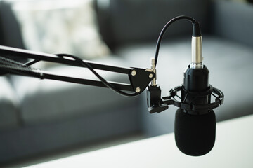Home sound recording studio and equipment including professional condenser microphone.
