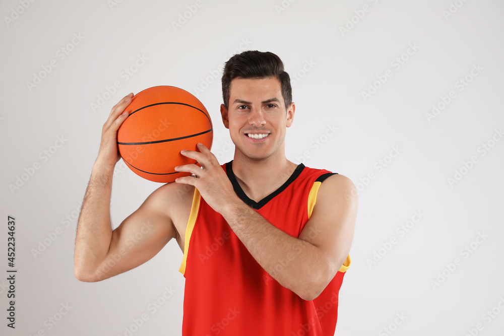 Canvas Prints Basketball player with ball on grey background