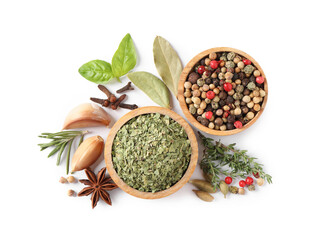 Different natural spices and herbs on white background, top view