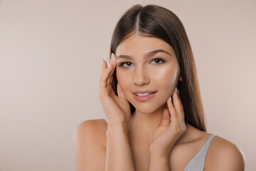 Portrait of pretty girl on light background. Beautiful face with perfect smooth skin