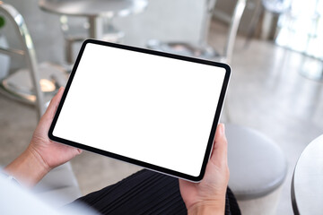 Mockup image of a woman holding digital tablet with blank white desktop screen