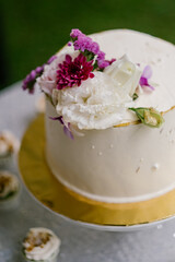 An elaborate dessert table setting at a wedding reception