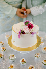 An elaborate dessert table setting at a wedding reception