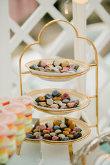 An elaborate dessert table setting at a wedding reception