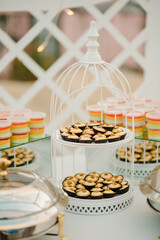 An elaborate dessert table setting at a wedding reception