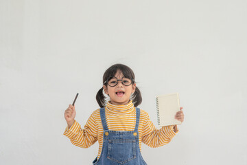Portrait of funny smiling little girl child wearing glasses