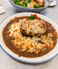 Japanese hamburg curry rice with mozzarella cheese - close up