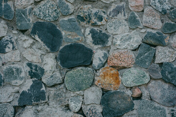 Part of a stone wall, for background or texture. Detail of stone wall. Close up