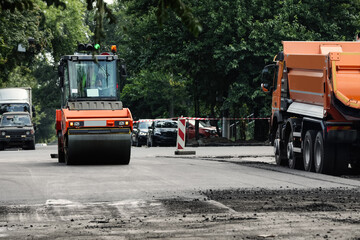 Obraz na płótnie Canvas Road repair machinery working on city street