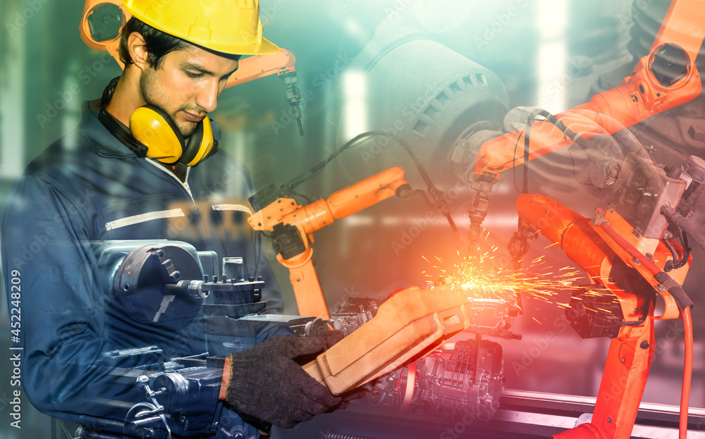 Poster mechanized industry robot arm and factory worker double exposure . concept of robotics technology fo