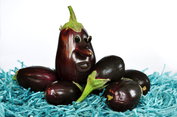 Fairytale Eggplant character on turquoise grass. Healthy food. Vegetables