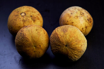 close-up ripe santol fruit isolated on black background