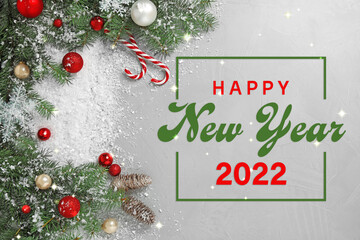 Happy New 2022 Year! Festive decoration with white snow on light grey stone background, flat lay
