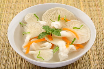 Homemade vegetarian food, meal, organic mushroom soup served in ceramic bowl.