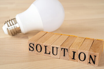 ソリューション、解決策｜「SOLUTION」と書かれたスタンプと電球 - obrazy, fototapety, plakaty