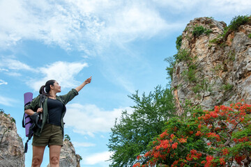 Woman travel  hiker adventure on mountain nature landscape.  Asia people lifestyle tourist girl backpack pointing find directions explore and camping outdoors for relax summer time