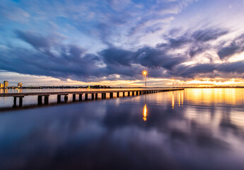 Romantic sunset, smooth water, at Como Jetty, Perth, Western Australia