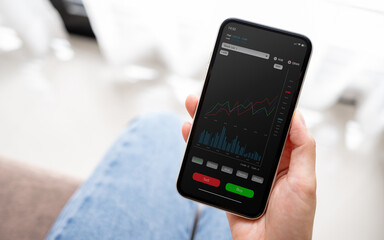 The younger generation is using laptops, phones and tablets with stock status information or stock charts. Stock trend chart graph analysis. Business concept