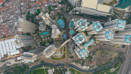 Aerial view of "Taman Anggrek" the biggest shopping mall and apartment in Jakarta when sunrise. Jakarta, Indonesia, August 22, 2021