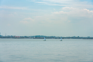 Singapore - july 15, 2018:  Sailing boats between Pulasu Ubin and Coney Island.
