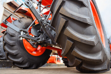 Close-up of tractor tires and wheels big tractor tires large vehicles Car are used for farming and...