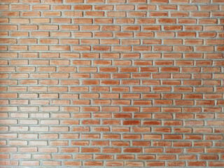 The walls of the house are made of red bricks.