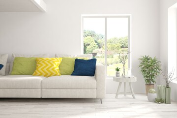 Minimalist living room in white color with sofa and summer landscape in window. Scandinavian interior design. 3D illustration