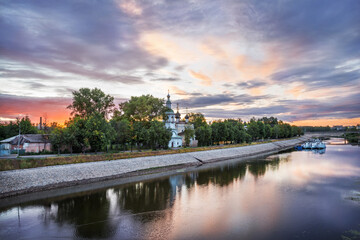 Fototapeta na wymiar Dmitry Prilutsky Church on the banks of the Vologda River in the city of Vologda