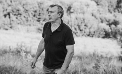 Fototapeta premium Mature European man with a sad philosophical mood. The concept of life after 50 years, problems and depression. Crisis of middle age
