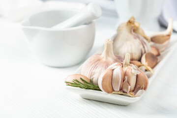 Fresh garlic bulbs with rosemary.