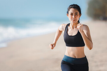 Fototapeta na wymiar Athlete female running on beach, Exercise jogging concept