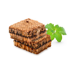 Honeycomb with mint leaves isolated on white background