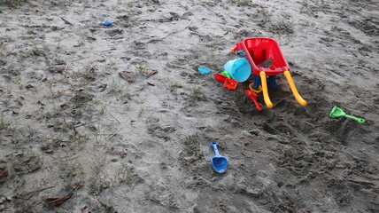 many colorful trolleys full and all kinds of toys in the Children's bunker  for the joyful concept of sandpit 