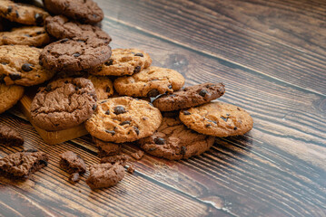 Stocked homemade chocolate chips on wooden table