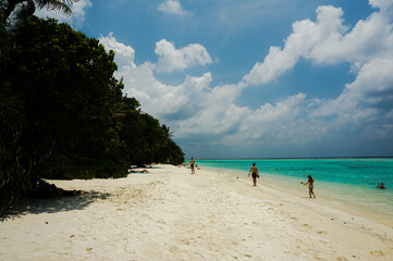 Tropical beach landscape. beautiful ocean wave, blue water and cloudy sky.