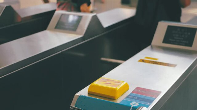 Undefined People using NFC card and tickets in subway terminal