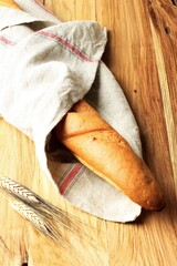 French Baguette Bread on Wooden Table, Selected Focus