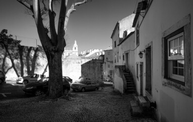 Alfama streets in the early morning. Lisbon old town. Black and white