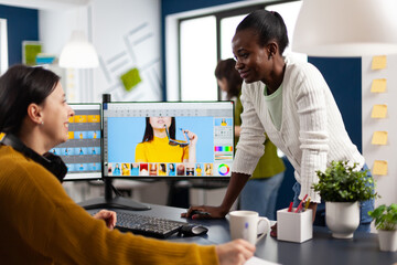 African art company director consulting retoucher colleague, retouching portrait, photo editing...